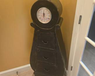 Charming vintage-style cabinet with clock face and three drawers. Classic piece for entryway or study. Solid wood construction, minor wear consistent with age.