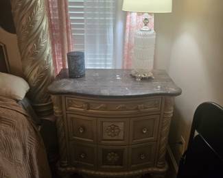 3-drawer nightstand with marble-look top and carved detailing. Approx. 30” W x 18” D x 30” H.