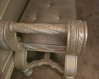 Upholstered bench with carved wood scroll arms, perfect at the foot of the bed. Approx. 48” W x 18” D x 22” H.