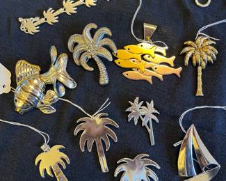 Collection of pens and pendants signed “Best”..  plus a bracelet 