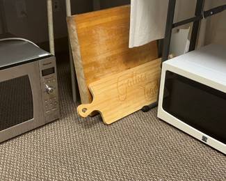 Microwaves and wooden cutting boards