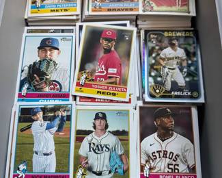 Hundreds of baseball, football, and basketball cards — a great find for collectors!