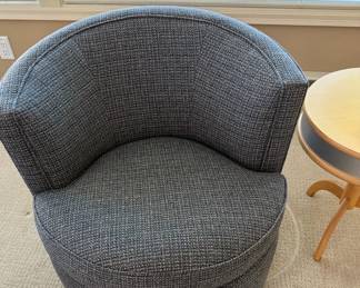 Yes it swivels and is so comfortable and it's from Room & Board Otis Swivel Chair