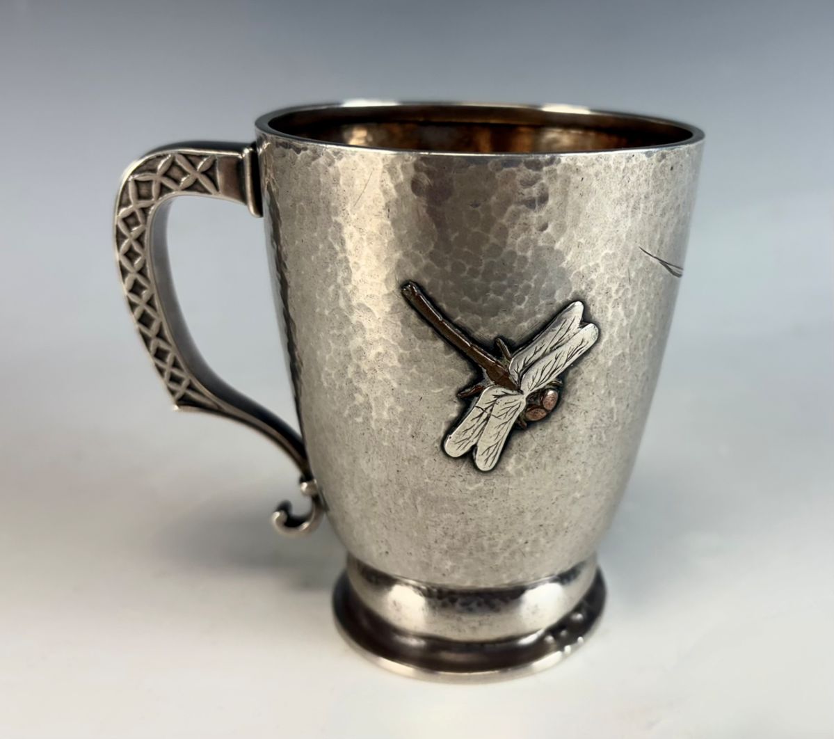 Lot# 126A. Tiffany & Company Sterling mixed metals handled cup with gold dragonfly.
