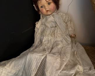Antique Doll wearing antique lace Christening gown