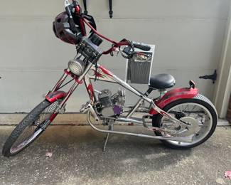 OCC Orange County Chopper Schwinn Stingray Bike- The bike was in the process of being converted to a peddle motor- Original seat included along with the parts to finish the motor.  Also has a "fake" gas tank for it that will be included.  Includes saddle bag and helmet
