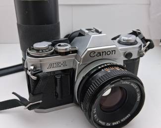 Canon camera with telephoto lens. Case included.