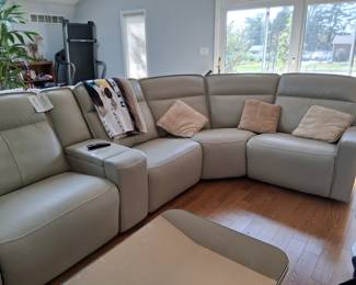 Leather Sectional Couch with power/charger. Reclines. New - tags still attached.