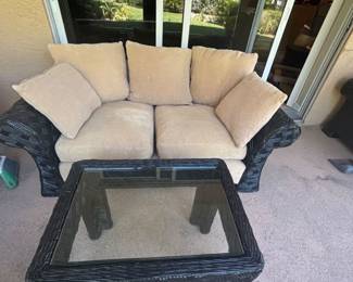 Two Ratan and Upholstered Loveseats with matching coffee table and end table