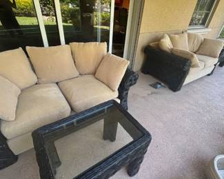 Two Ratan and Upholstered Loveseats with matching coffee table and end table