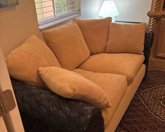 Two Ratan and Upholstered Loveseats with matching coffee table and end table