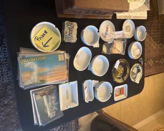 Collectible vintage ashtrays and postcards