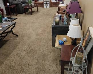 coffee table, sofa, rocker/recliner, wooden column, side tables, end tables, filing cabinets, tiered metal stand, upholstered child’s chair, lamps