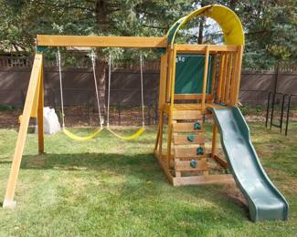 swing set with slide, climbing wall