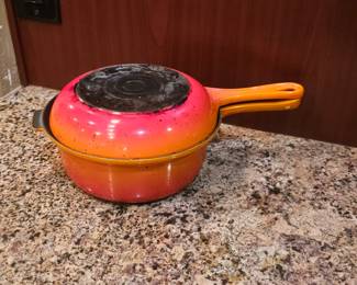 Le Creuset Multifunction 2-in-1 Sauce Pan and Skillet, also known as a Casserole 2-in-1 Evolution. It is made of enameled cast iron and features a saucepan with a lid that can also be used as a skillet. 