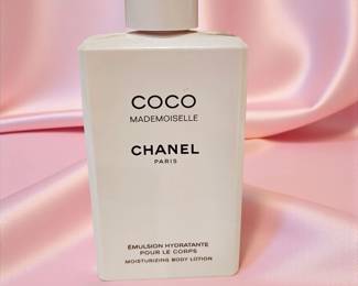 Elegant Chanel Coco Mademoiselle moisturizing body lotion in the classic white 6.8 fl oz bottle. Features the signature floral-oriental scent known for its light, feminine notes. Excellent condition with minimal wear to packaging. 