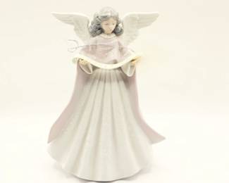 Lladro porcelain figurine, specifically a "Singer Angel" or "Angel Tree Topper" with the model number 5831. 