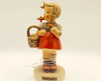 vintage Schmid "Little Shopper" or "Sweetheart" ornament, which is a reproduction of a statuette designed by Berta Hummel. 