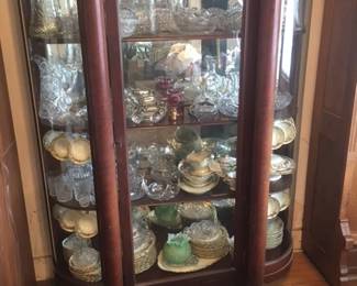 Bowfront China cabinet full of American cut glass.  China cabinet SOLD