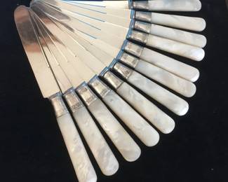 Mother of pearl dinner knives with sterling bands