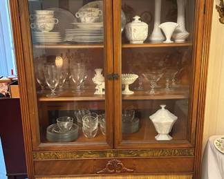 Beautiful antique china cabinet.  I spy some Westmoreland and Fenton hiding in there!