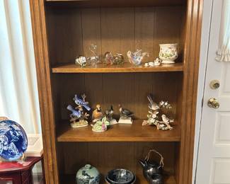 Solid wood bookcase with doors at bottom.  Quality piece.  and so many nice collectibles!