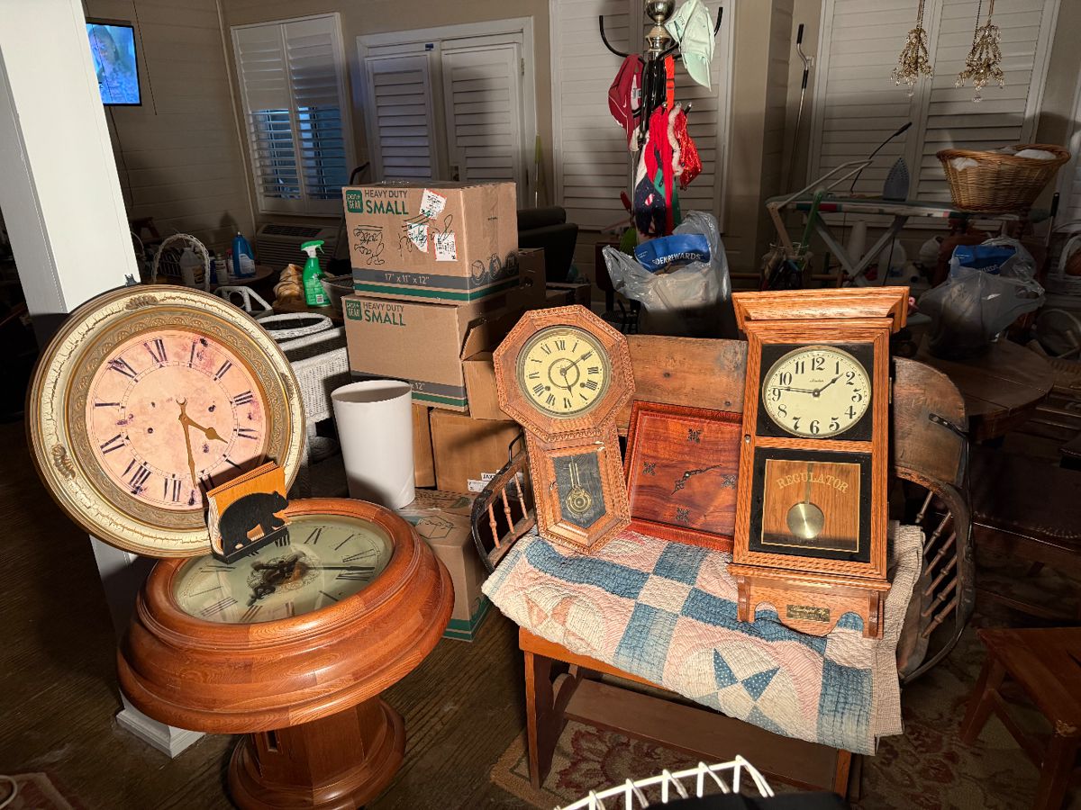 Clocks and antique buggy seat adapted as bench