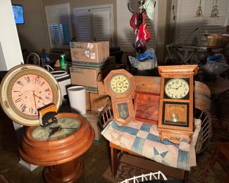 Clocks and antique buggy seat adapted as bench