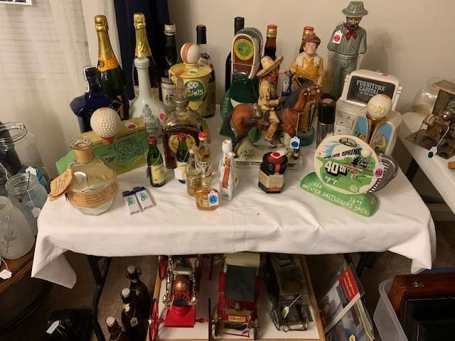 Alcohol bottles unopened and opened. Collector figures. For the baseball and golf lover and Western culture lover. Vehicles and more.