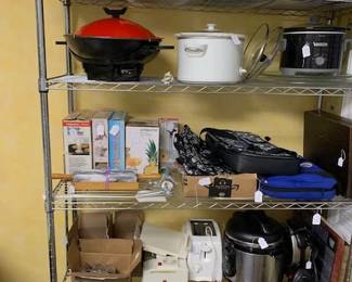 Appliances galore! Pots, pans, toasters, casserole carriers, waffle maker, crock pot, slow cookers, seafood pots, pasta pots. Lots of kitchen items! 