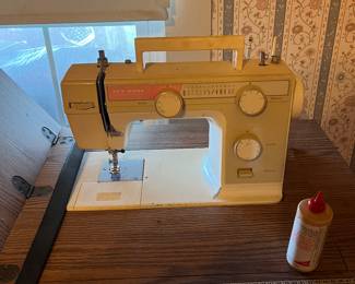 New Home sewing machine and cabinet