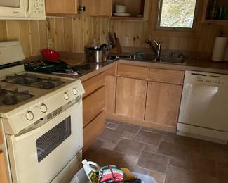 Its all for sale cupboards, appliances, even the tongue and groove walls