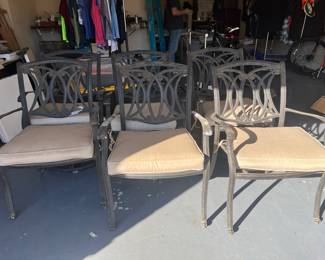 There are six of these patio chairs. Four side chairs and two chairs that swivel.