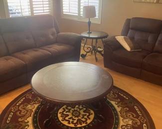 Matching living room set with reclining sofa and love seat. coffee table and 2 end tables and matching rugs