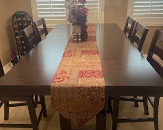 large dining room table with 8 matching tables. Dark wood color, very beautiful and great quality.