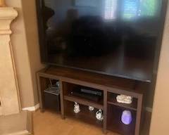 Large smart tv and tv stand.