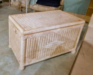 A wicker storage trunk for blankets, games, or any treasure you desire!
