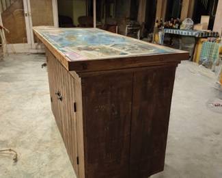 This rustic reclaimed wood sideboard or kitchen island has a marble top. It has excellent storage, too! See the next photo to see the inside...