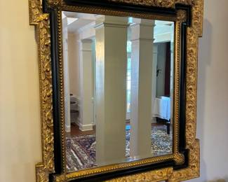 French Regency black and gold mirror