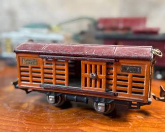This lot features a collection of five (5) pre-war model train cars, manufactured by Lionel and all most likely O gauge. Includes a locomotive, a box car, a few cabooses, and more.
