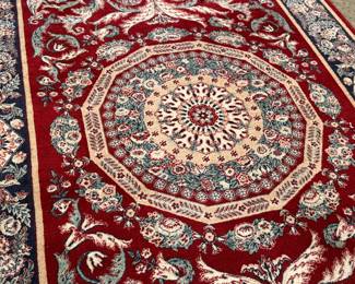 This lot features a Persian style rug that measures, 94” H x 63” W. 
