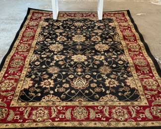 This lot features a modern Turkish style rug that measures, 89” H X 63” W.
