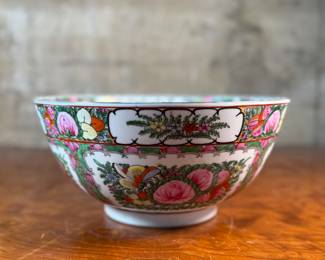This lot features an antique Chinese rose medallion bowl in excellent condition that measures, 5.5” H x 12” W x 12” D. Marked underneath, "Overjoy" which is generally associated with porcelain that was hand-painted in Hong Kong.
