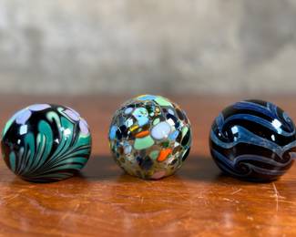This lot features a collection of three (3) paperweights, all signed by Haberman Art Glass.
