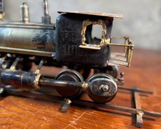 This lot features a unique handcrafted locomotive sculpture made of various metals and salvaged materials. It has a brass plaque mounted on top from Jacksonville, Oregon. This sculpture measures, 6” H x 13” W x 5” D.
