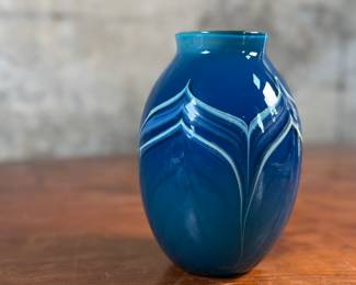 This lot features a stunning vase by Haberman Art Glass, signed underneath as shown in photos, circa 1985. This vase measures, 7” H x 4.5” W x 4.5” D.
