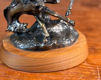 “Weaver”, a bronze sculpture after listed artist C.M. Russell. Signed as shown in photos and measures, 8” H x 6” W x 5” D. Charles Marion Russell, also known as C. M. Russell, Charlie Russell, and “Kid” Russell, was an American artist of the American Old West. He created more than 2,000 paintings of cowboys, Native Americans, and landscapes set in the western United States and in Alberta, Canada, in addition to bronze sculptures.
