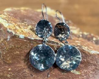 This lot features a pair of sterling silver earrings, manufactured and signed by ZINA with a total approx. weight of 10.94 grams.
