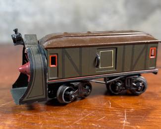 This lot features a collection of three (3) vintage toy train cars, most likely manufactured by Ives Railway Lines. One is marked, “Germany” underneath as shown in photos. All of them appear to be O gauge models.
