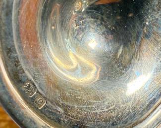 This lot features an antique sterling silver mustard pot with spoon. Marked as shown in photos with a total approx. weight of 62.08 grams.
